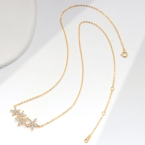 S925 sterling silver gold flower necklace with marquise-cut white zircon in high-key lighting