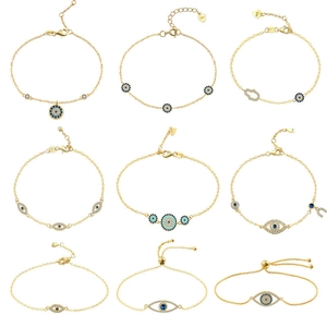 Collection of nine gold S925 silver Evil Eye and Hamsa bracelets with blue zircons
