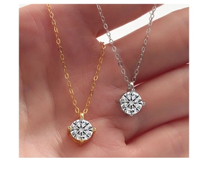 Close-up of S925 sterling silver necklaces with sparkling round cubic zirconia pendants