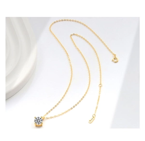 Detailed view of S925 sterling silver stamp on a gold-plated single diamond necklace