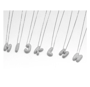 Macro view of 3D bubble letter pendants H to N with full pave cubic zirconia stones