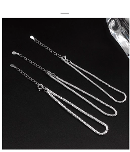 Macro shot of three S925 sterling silver necklaces with lobster clasp and drop pendant