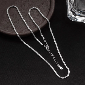 Detail of S925 sterling silver chain with lobster clasp and heart tag showing authenticity