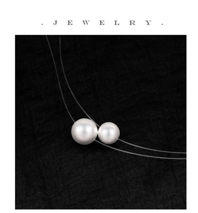 Detailed macro view of high-lustre white pearls on invisible thin jewelry string