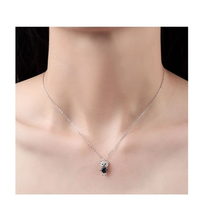 Close-up of S925 silver necklace featuring a bear pendant with blue crystal and micro-diamonds
