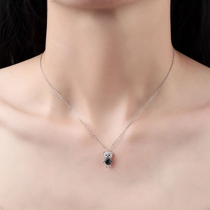 S925 sterling silver necklace with a cute blue crystal bear pendant on female model