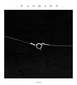 Macro shot of S925 sterling silver spring clasp and black fishing line cord detail