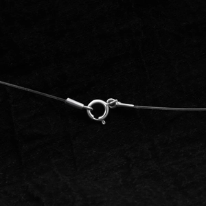 Detailed view of the S925 sterling silver spring ring clasp on a pearl necklace