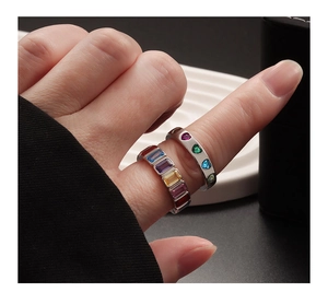 Close-up of S925 silver rings featuring colorful heart and rectangular gemstones