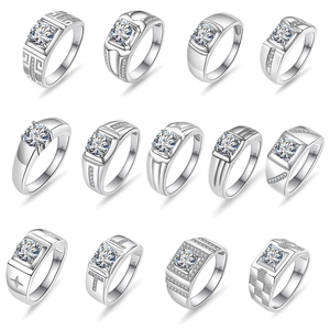 Macro detail of various S925 sterling silver rings with moissanite stones and diverse engravings