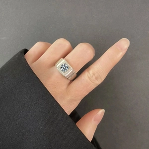 Detailed view of men's S925 sterling silver ring with a large center moissanite stone