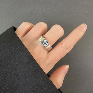 Close-up of a men's 925 sterling silver ring featuring a large brilliant moissanite stone