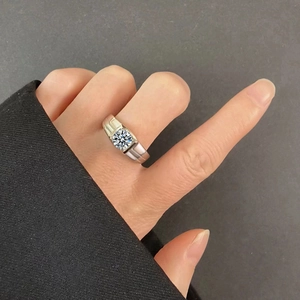 Close-up of a men's S925 silver ring with a large moissanite diamond on a hand