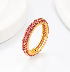 Detail of S925 sterling silver ring featuring pink zirconia pave setting on gold base
