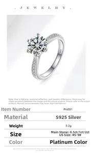Detail of S925 silver ring featuring a six-prong 1 carat moissanite and engraved band