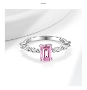 Macro detail of S925 silver ring featuring rectangular pink gem and marquise white diamonds