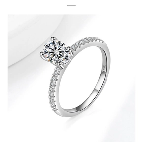 Close-up of S925 sterling silver ring with oval moissanite in classic four-prong setting