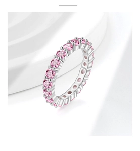 Macro shot of S925 sterling silver stamp and pink zircon pavé setting on minimalist ring