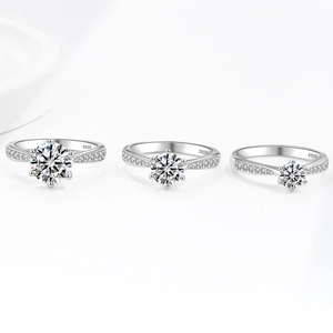 Three S925 sterling silver rings with 6-prong moissanite in a minimalist design
