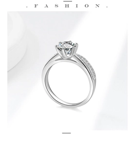 Detailed shot of S925 sterling silver ring with six-prong moissanite and side diamond accents