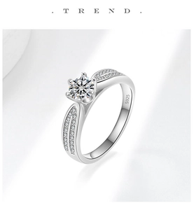 Detailed close-up of S925 sterling silver ring with six-prong moissanite setting and hallmark
