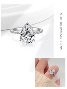 Dettaglio anello in argento S925 con zircone a pera e fascia con pavé di micro-diamanti