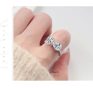 Close-up of S925 silver ring featuring rectangle and pear-cut cubic zirconia stones