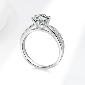 Classic 925 silver six-prong ring with a 2-carat round moissanite and pave accents