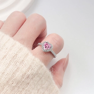 S925 silver ring featuring a heart-shaped pink gem with pave-set diamonds on model