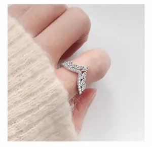 Close-up of V-shaped 925 silver ring featuring marquise-cut moissanite stones