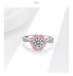 Macro detail of S925 silver ring with pink floral cluster and spiral diamond band