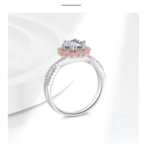 Detailed macro view of silver ring with pink halo and hexagonal diamond setting