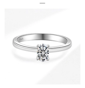Close-up of S925 sterling silver stamp and oval-cut moissanite stone in 4-claw setting