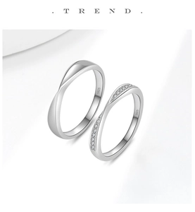 Nahaufnahme von S925 Sterling Silber Partnerringen mit Moissanit und eingravierten Details