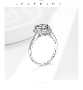 Macro shot of heart-shaped moissanite ring with halo setting and pavé diamonds