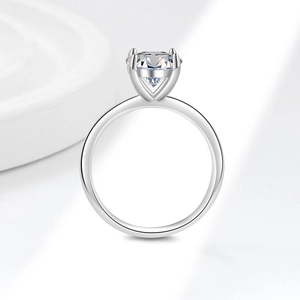 Minimalist s925 silver ring featuring a large brilliant round moissanite in a 4-prong setting