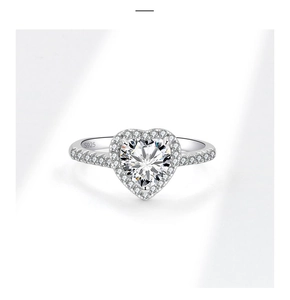 Macro shot of S925 sterling silver ring with heart-cut diamond and pavé setting details