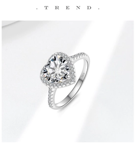 Detail of S925 sterling silver heart-shaped moissanite ring with pave-set diamond accents