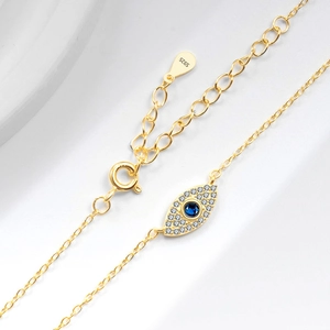 Bracelet élégant en argent sterling S925 doré avec pendentif œil bleu et zircons pavés