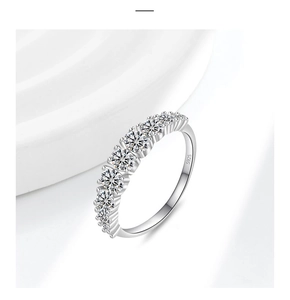 Detailed macro of S925 sterling silver band featuring seven claw-set sparkling stones