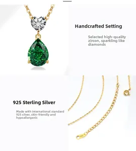 Detailed view of S925 sterling silver stamp on golden chain with green pear zircon pendant