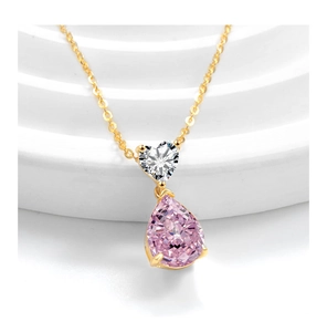 Detail of s925 silver necklace with pink teardrop and heart-shaped crystal pendants