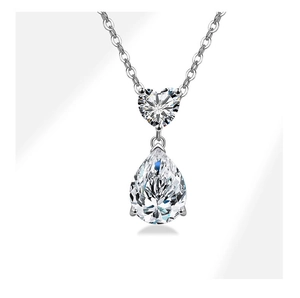 Detail of S925 silver necklace featuring heart and teardrop cut cubic zirconia stones