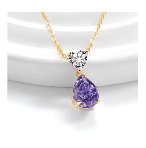 Close-up of a s925 silver necklace with heart-shaped and purple pear-cut crystal pendant
