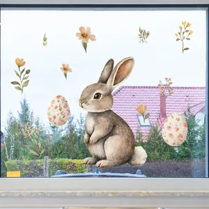 Close-up of Easter window clings with watercolor bunny and floral eggs on glass door