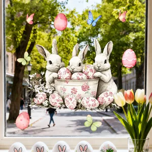 Close-up of Easter double-sided window decals with cute white bunnies and colorful eggs