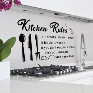 Detail of Kitchen Rules wall decal with utensils on a modern kitchen backsplash