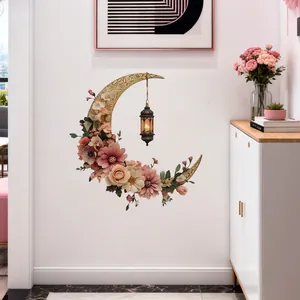 Detail of floral crescent moon wall sticker with vintage lantern in a warm home setting