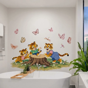 Detailed view of watercolor cartoon tiger wall decals with butterflies on a white bathroom wall