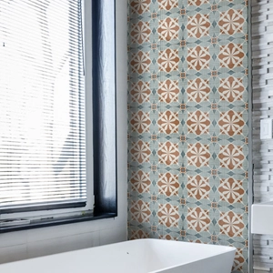 Detail of retro waterproof tile stickers with geometric floral patterns in bath area